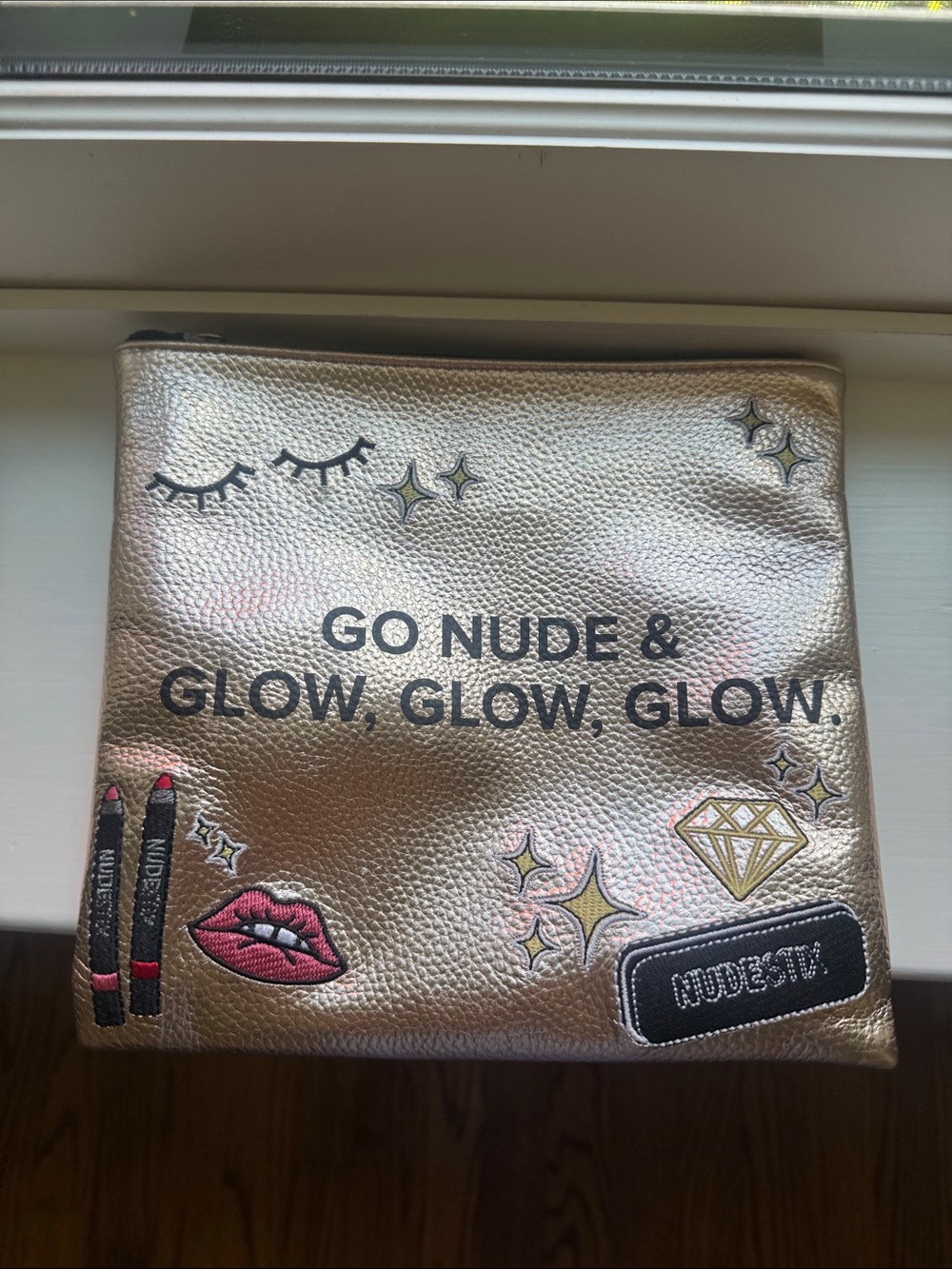 NUDESTIX Metallic Rose Gold Makeup Pouch with Graphic Accents